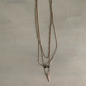 Gold layered necklace with different charms